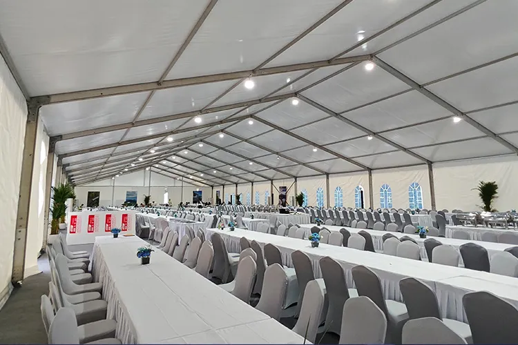 Interior view of a column-free clear span tent with custom exhibition booths